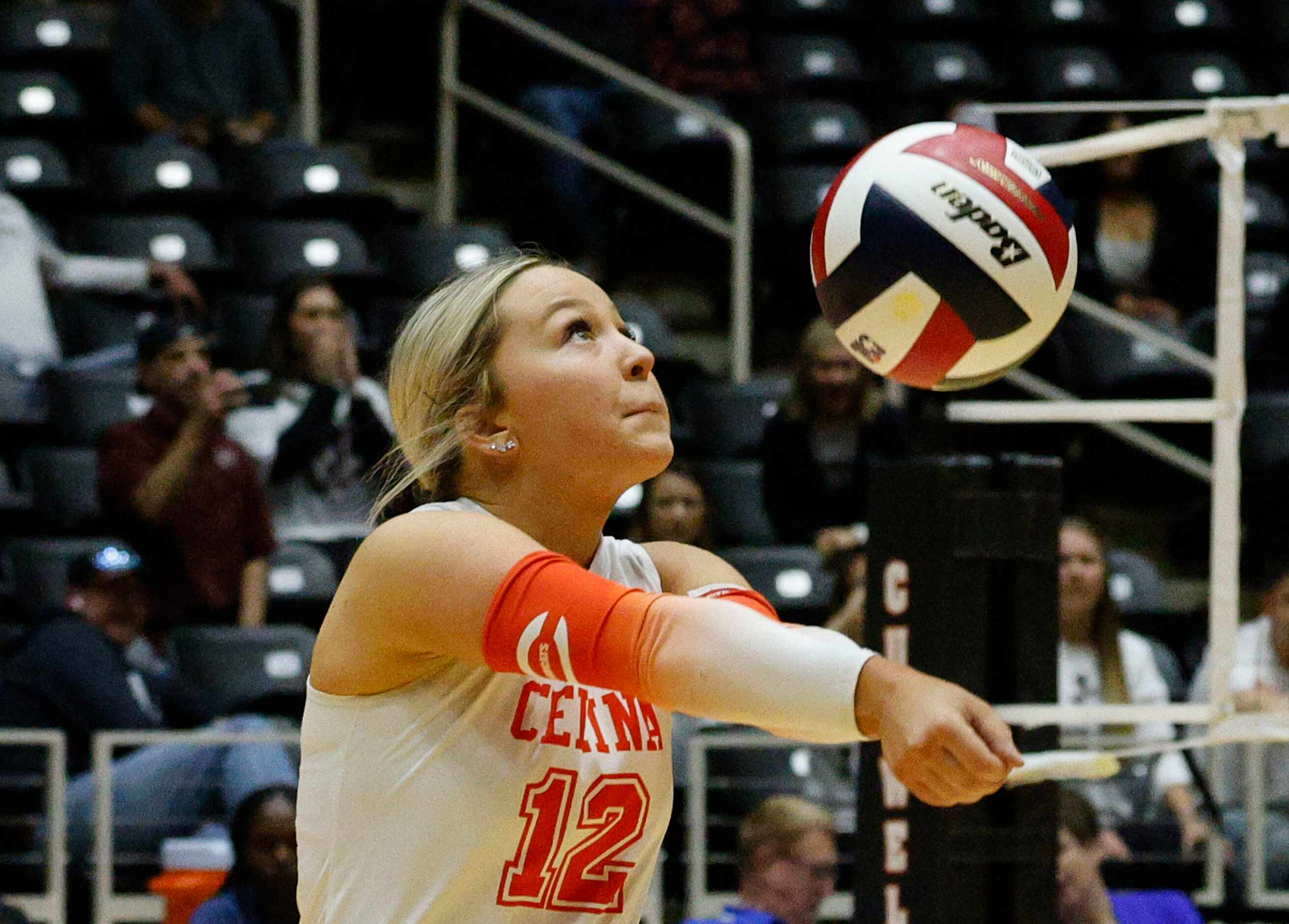 Celina's Reagan Radtke (12) digs the ball against Comal Davenport in the second set during a...