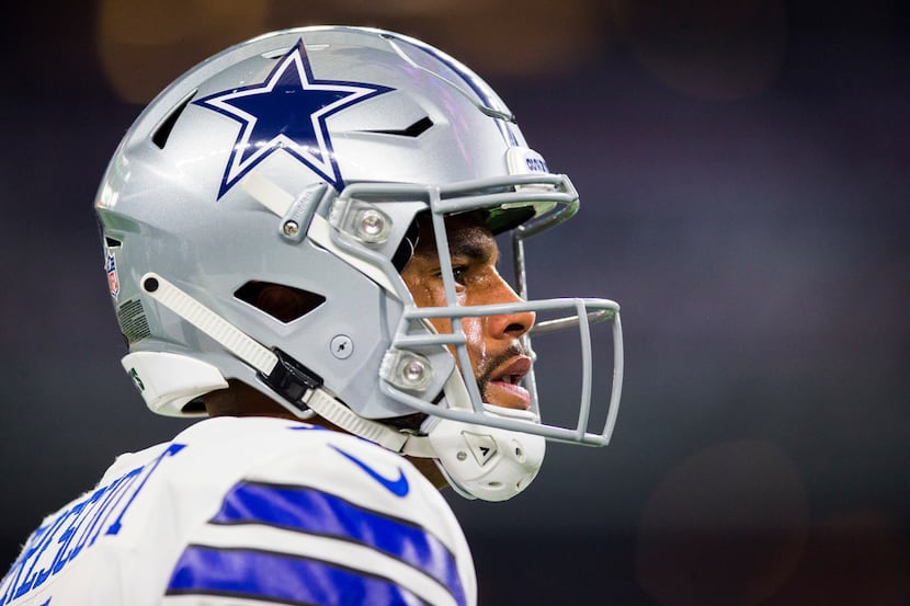 Dallas Cowboys quarterback Dak Prescott (4) looks up during warmups before an NFL game...