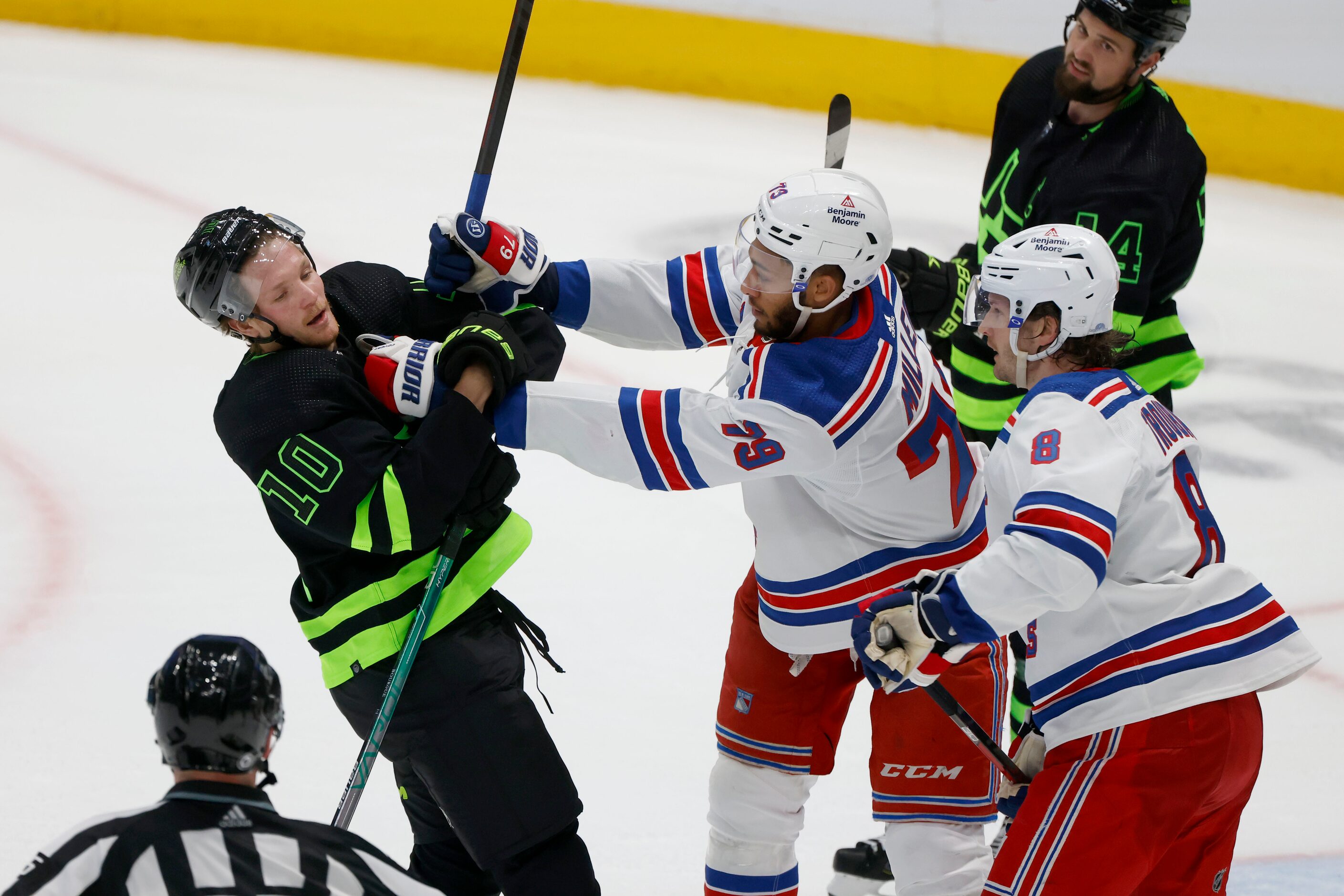 Dallas Stars center Ty Dellandrea (10) scuffles with New York Rangers defensemen K'Andre...