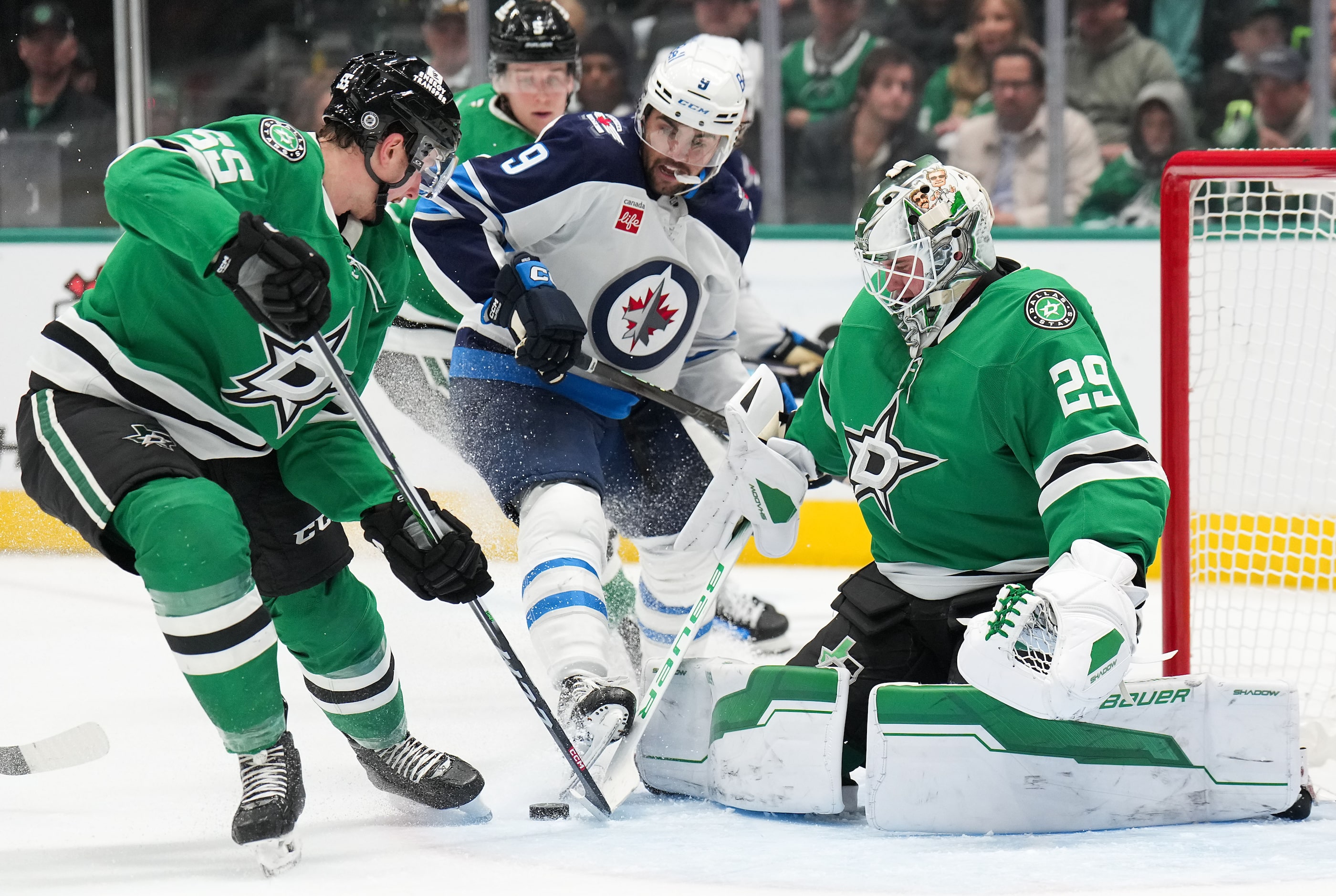 Dallas Stars defenseman Thomas Harley (55) clears the puck after goaltender Jake Oettinger...