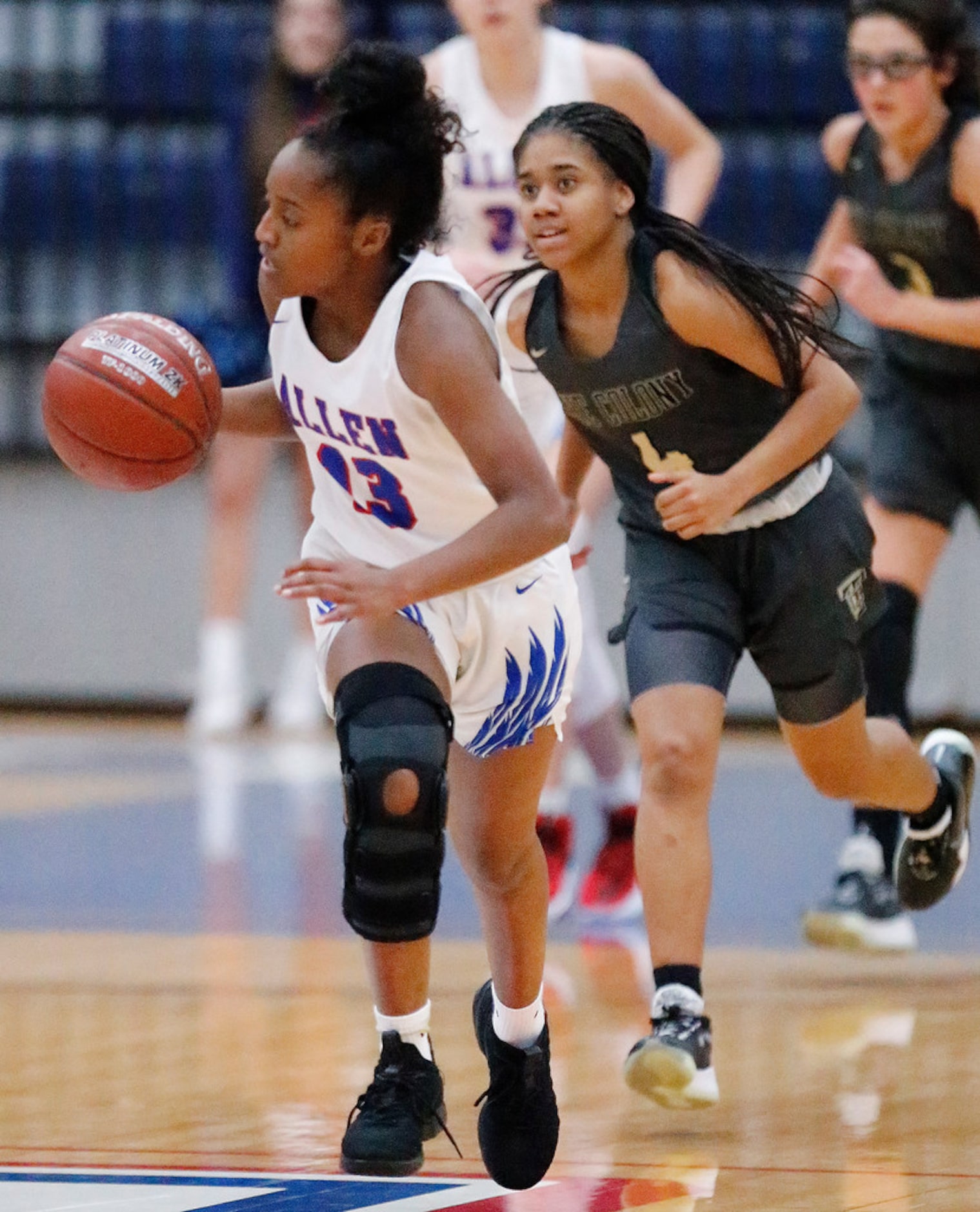 Allen High School Zoe Jackson (13) takes off with the basketball after as steal while The...