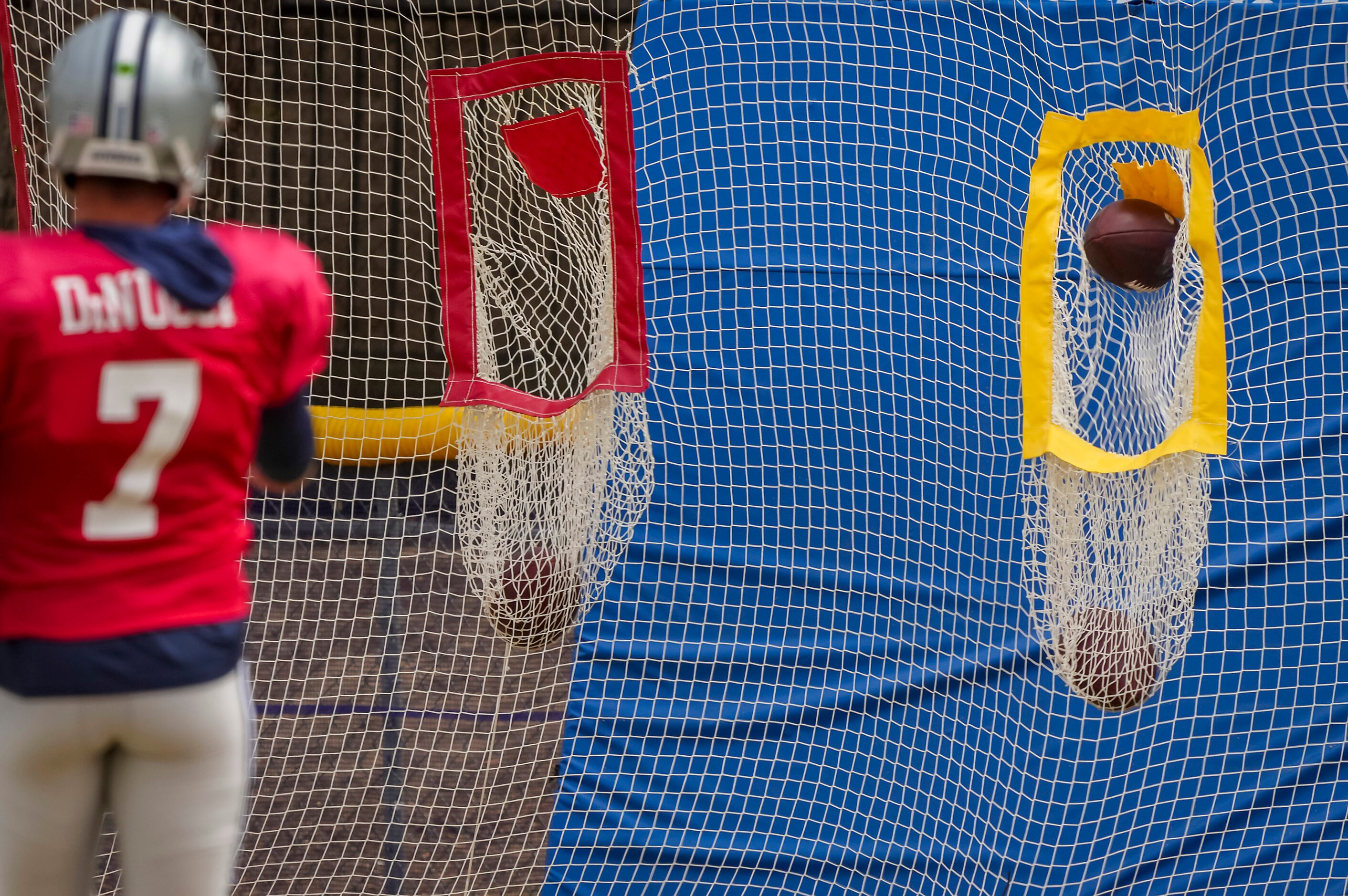 Dallas Cowboys quarterback Ben DiNucci (7) hits a target with a pass during a practice at...