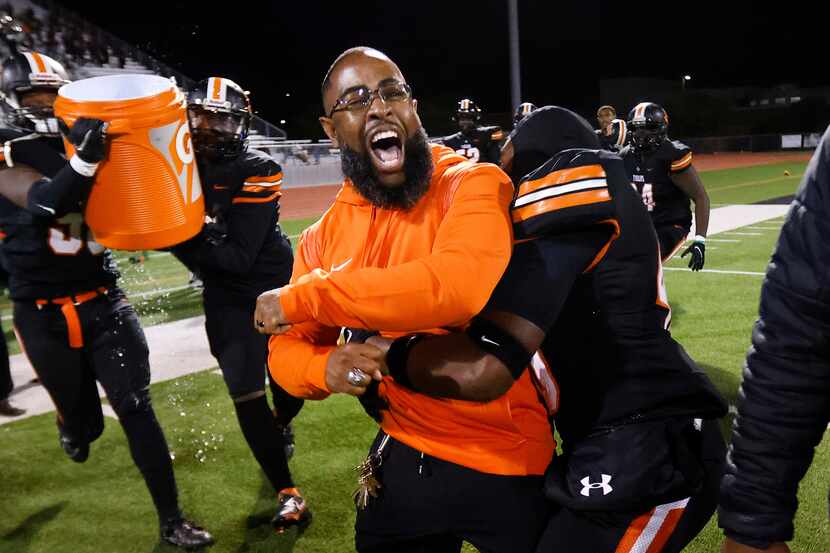 Lancaster head coach Leon Paul celebrates his first playoff win with a 35-15 defeat of...