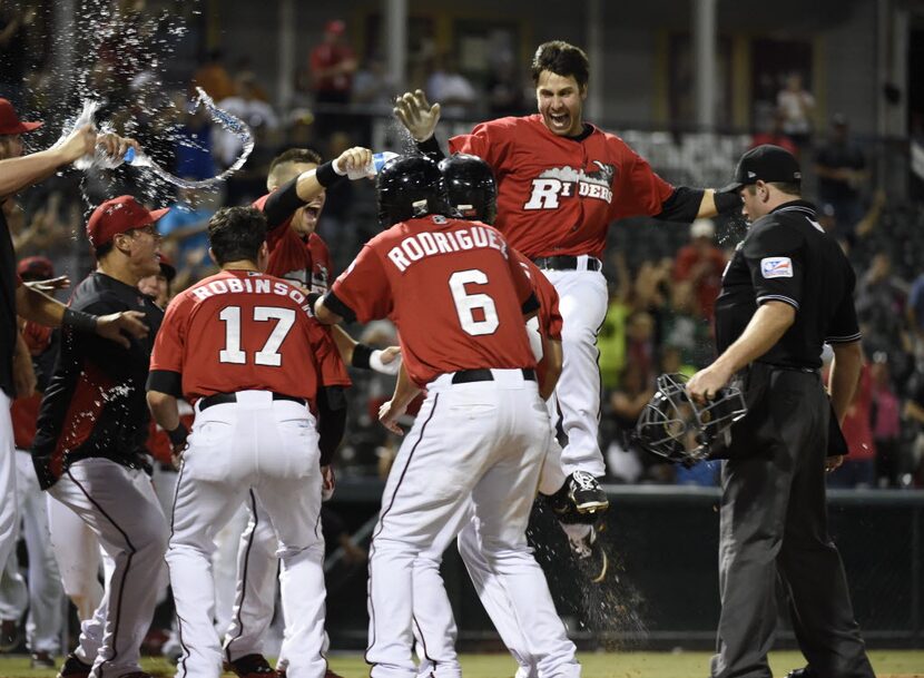 Third baseman Joey Gallo celebrates his three-run home run to win against the Midland...