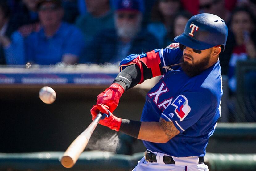 Texas Rangers second baseman Rougned Odor bats during the second inning of a spring training...