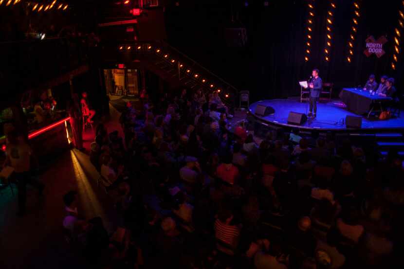 David Crabb (on stage) emcees the Literary Death Match during the Lit Crawl Austin  at The...