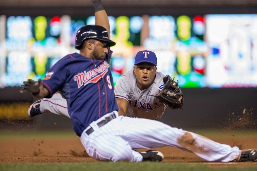 May 27, 2014; Minneapolis, MN, USA; Texas Rangers third baseman Adrian Beltre (29) attempts...