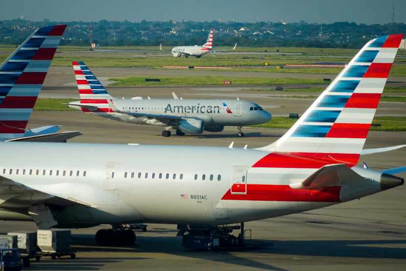 American Airlines planes are seen at the gates of Terminal D at DFW Airport on Sept. 24.