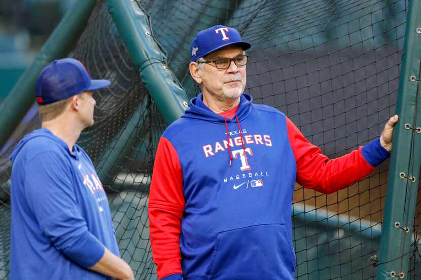 Texas Rangers manager Bruce Bochy (right) talks near the batting cage during an off day...