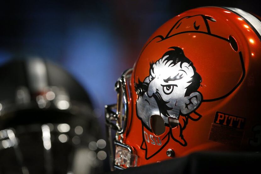 An Oklahoma State helmet sports the Cowboys mascot during a Q&A media session during the Big...