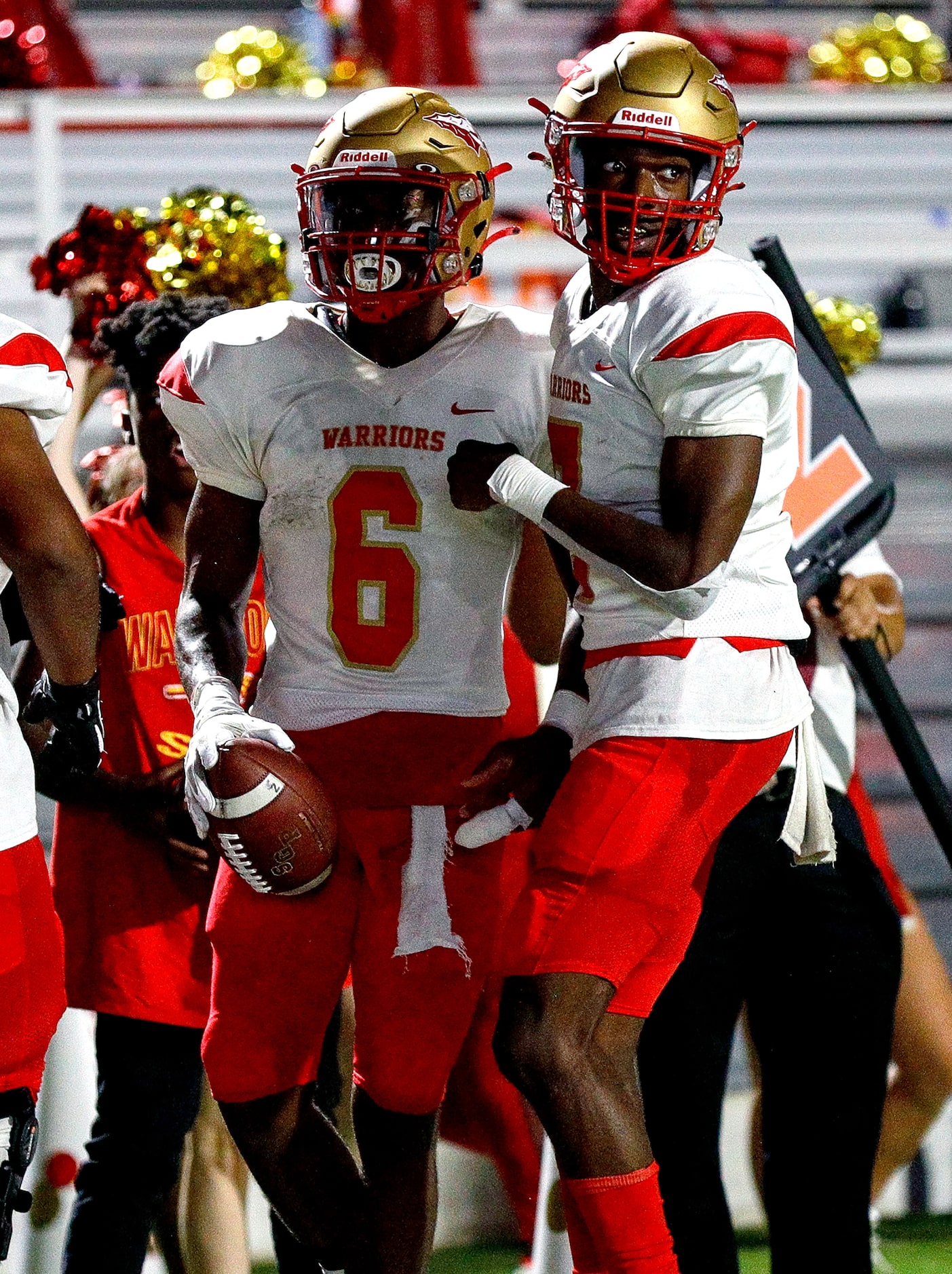 South Grand Prairie running back AJ Newberry (6) and quarterback Michael Stallworth (R)...