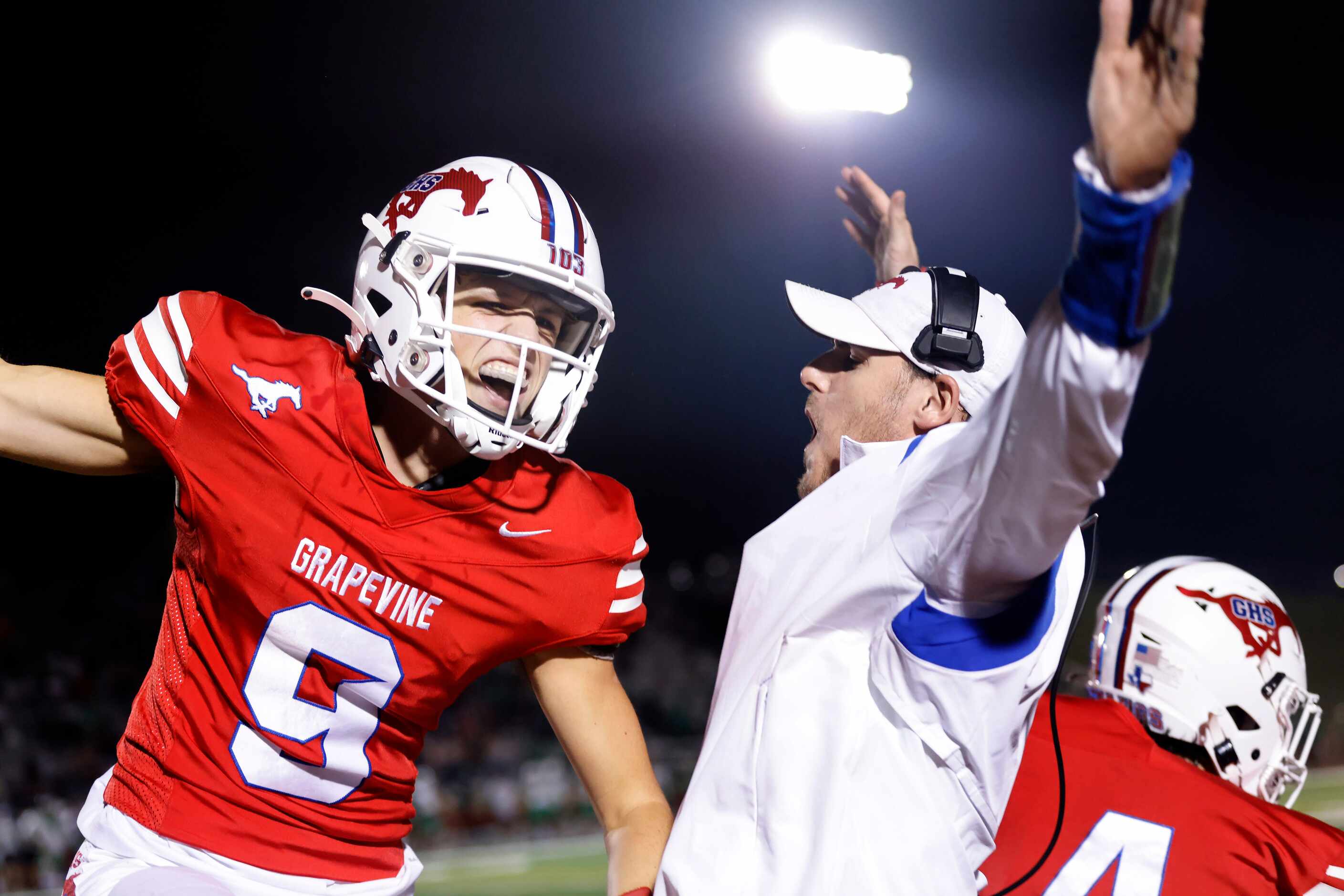 Grapevine quarterback Evan Baum (9) celebrates a first quarter touchdown against Lake Dallas...