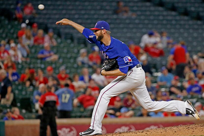 Texas Rangers relief pitcher Chris Martin (31) throws a pitch against Cincinnati Reds during...