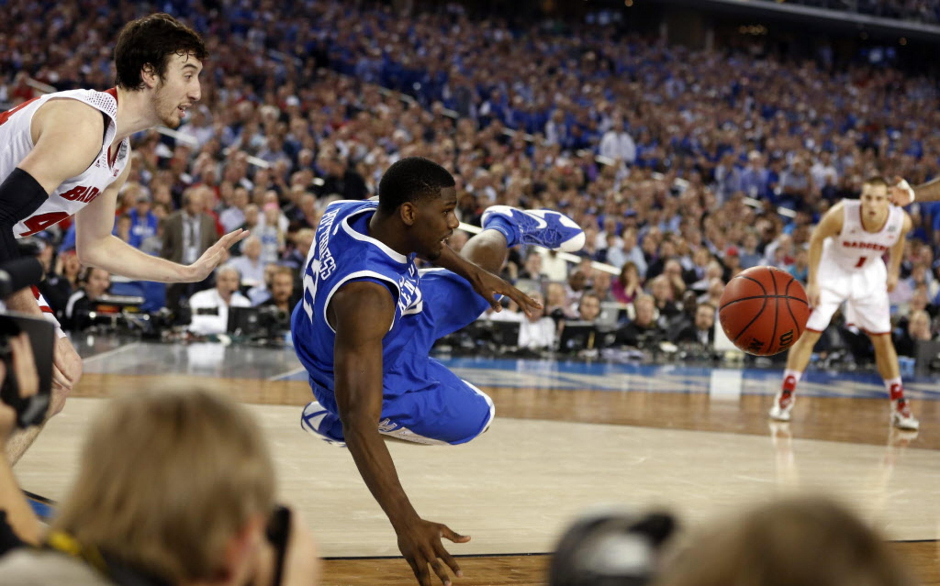 Kentucky Wildcats forward Alex Poythress (22) saves the ball from going out of bounds after...