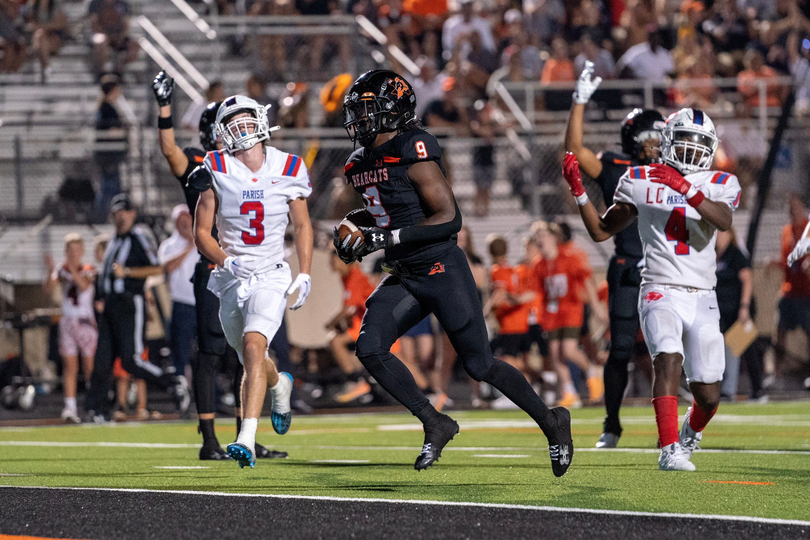 Aledo sophomore running back Raycine Guillory (9) scores a touchdown in front of Parish...