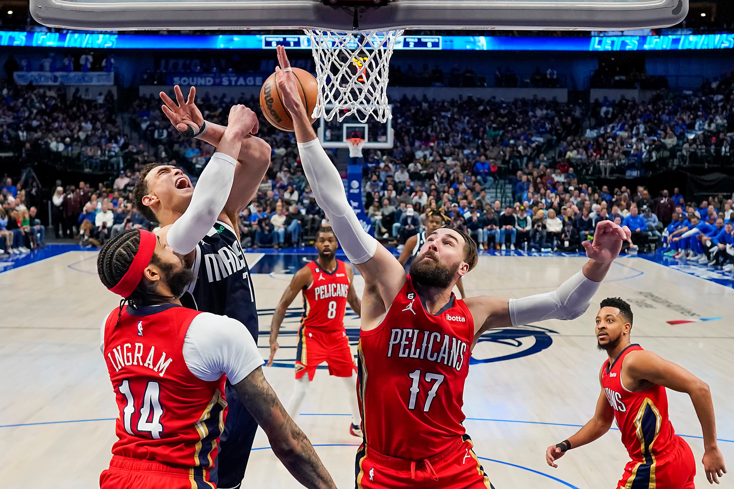 Dallas Mavericks center Dwight Powell (7) is fouled by New Orleans Pelicans center Jonas...