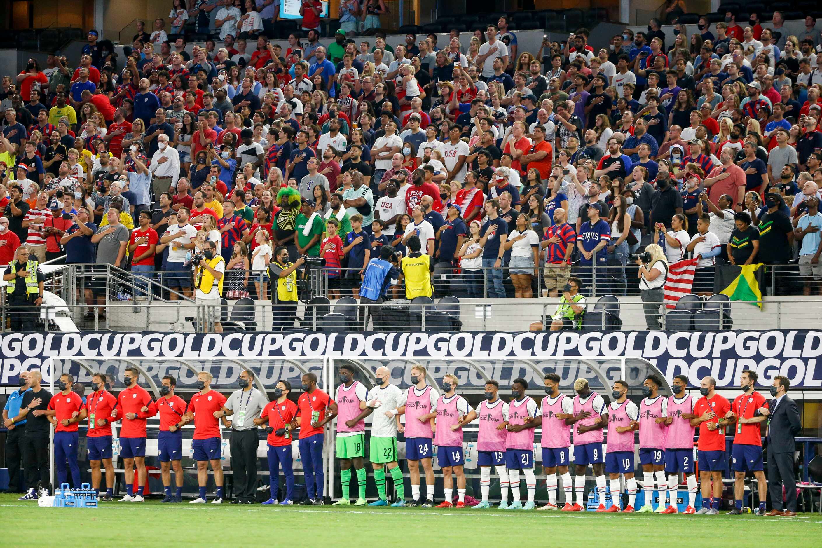The USA men’s national team and fans stand for the national anthem before a CONCACAF Gold...