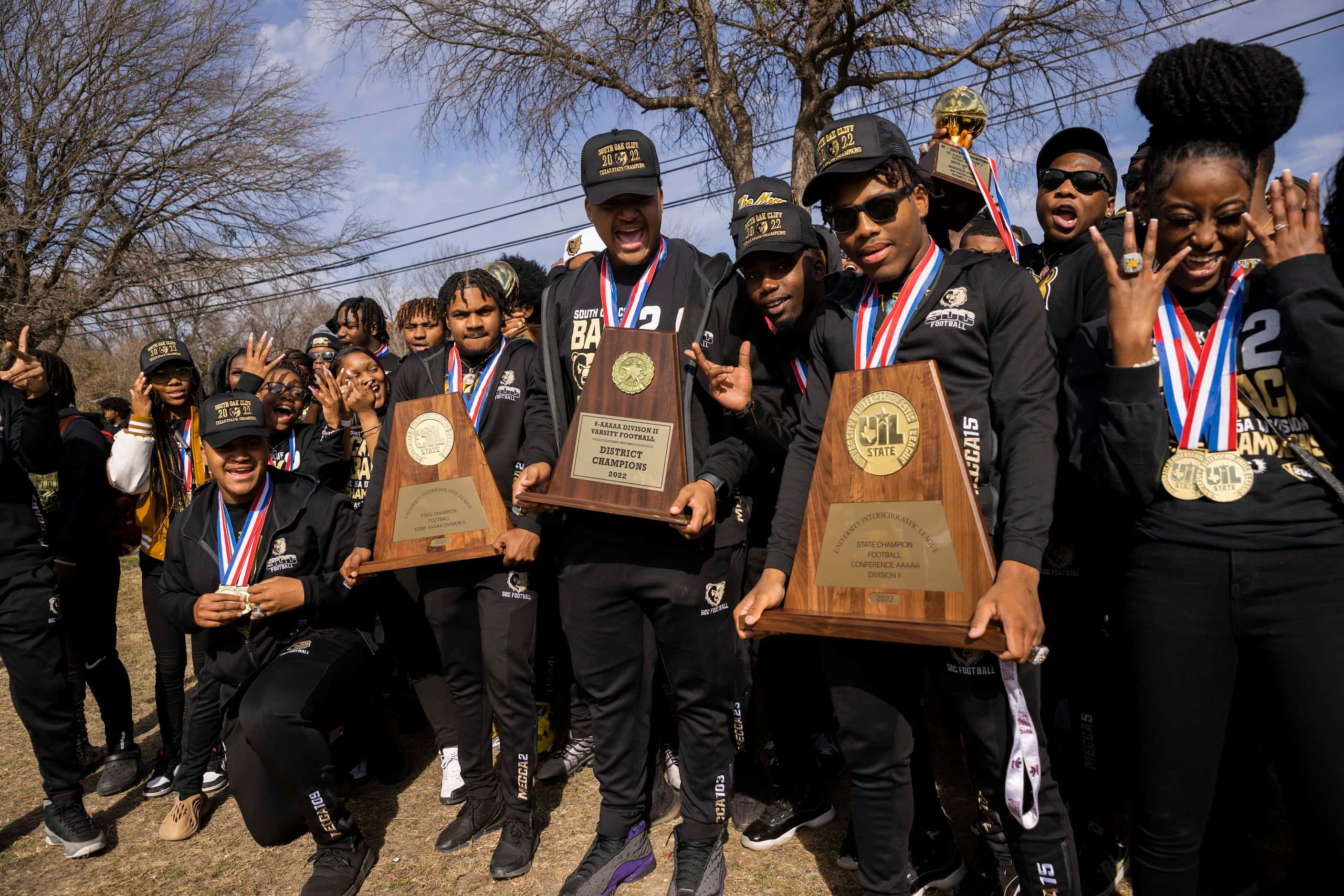 The South Oak Cliff Golden Bears football players pose for a photos during a celebration for...