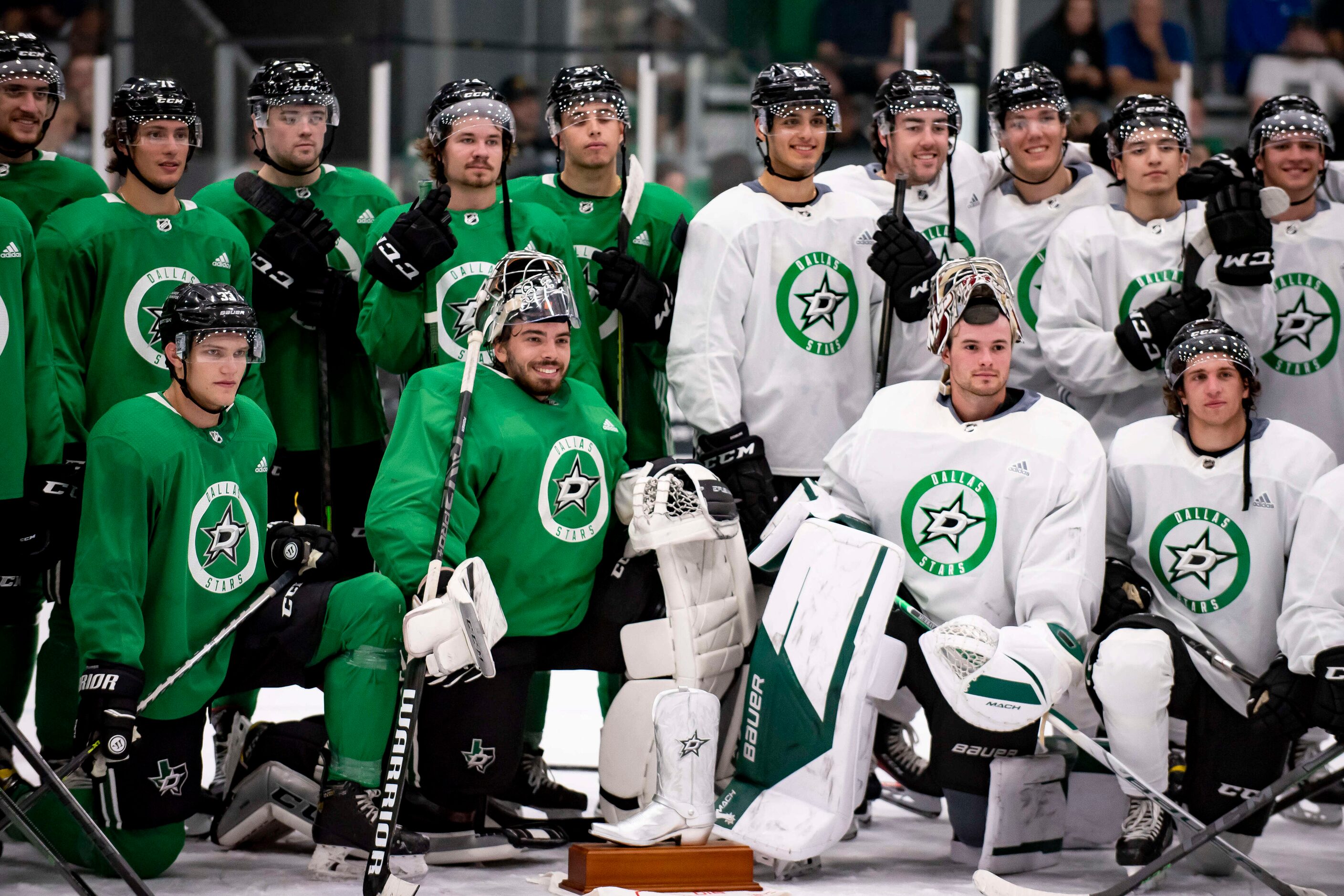 Players pose with the Lightning McQueen Cup at the end of the 2022 Dallas Stars Development...