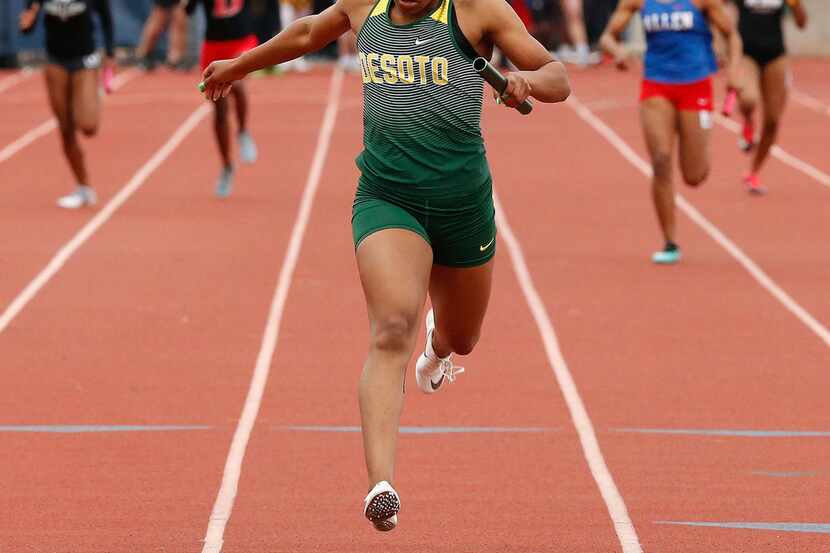 DeSoto's Ja'Era Griffin crosses the finish line first in the girls 4x200-meter relay at...