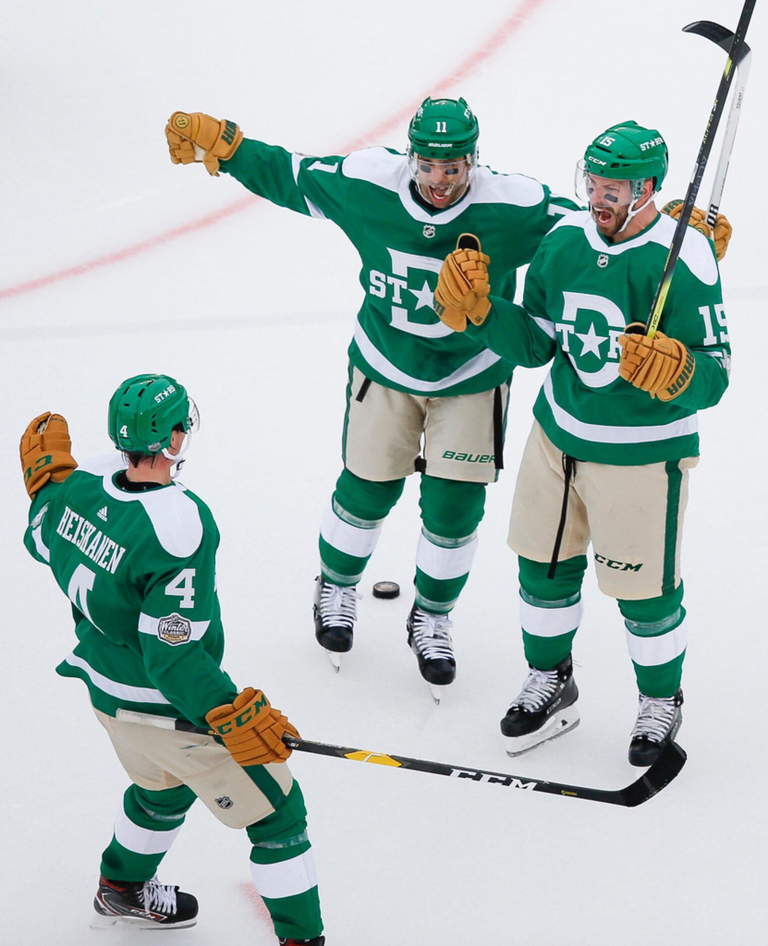 Dallas Stars left wing Blake Comeau (15) celebrates with center Andrew Cogliano (11) and...