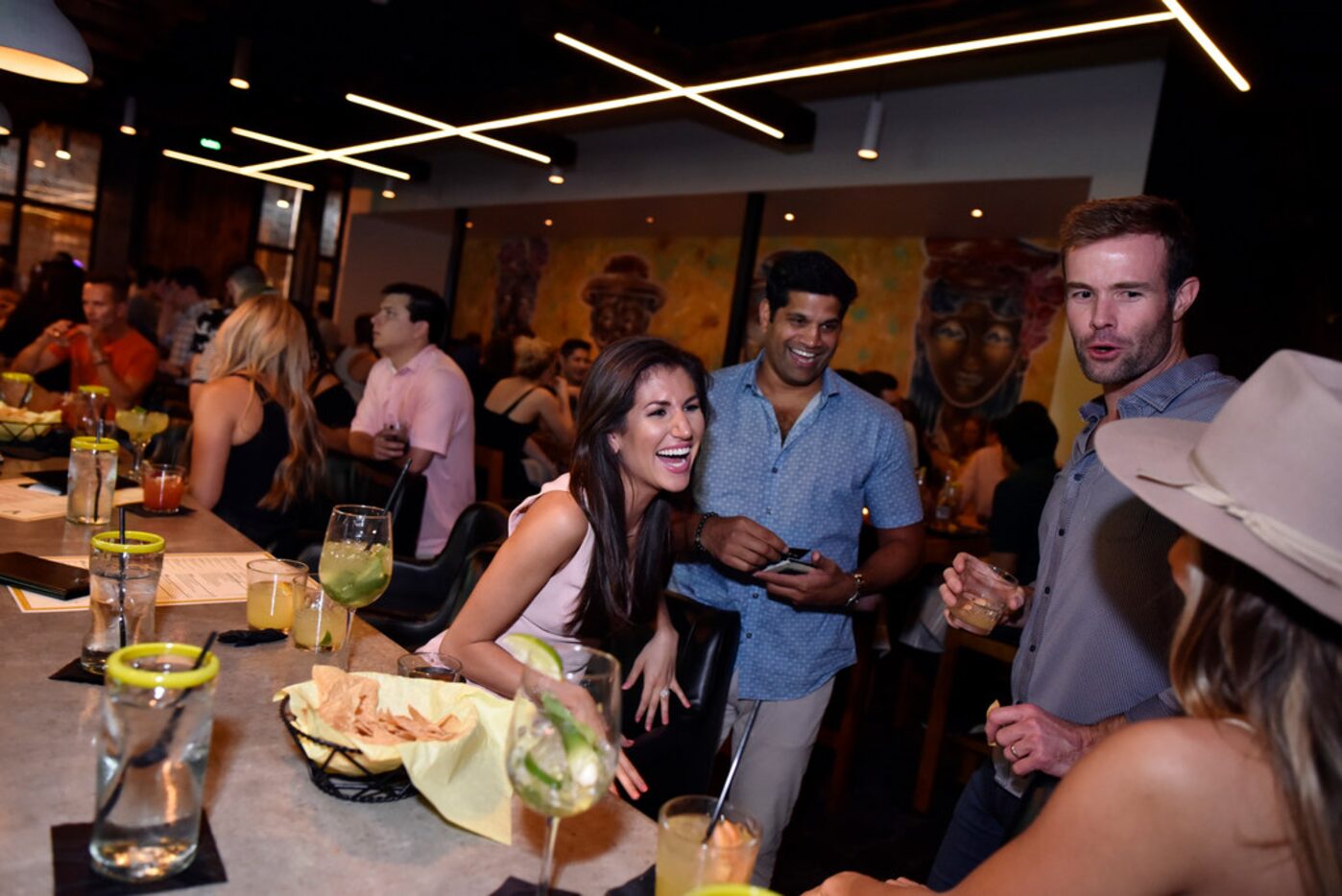 Jenn DeSouza, left, OJ DeSouza, Cameron Lawrence and Stacey Lawrence, enjoy drinks at the...