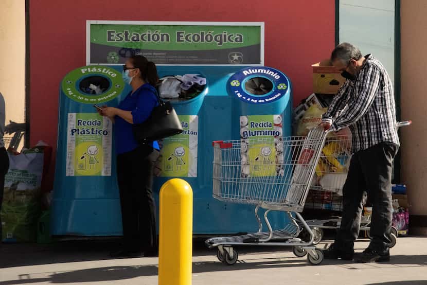 People line up outside of S-Mart, a supermarket chain, Thursday, April 30, under the desert...