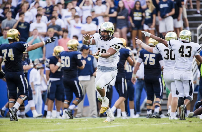 Plano East linebacker Anthony Hines III (19, left) celebrates after East recovered a fumble...