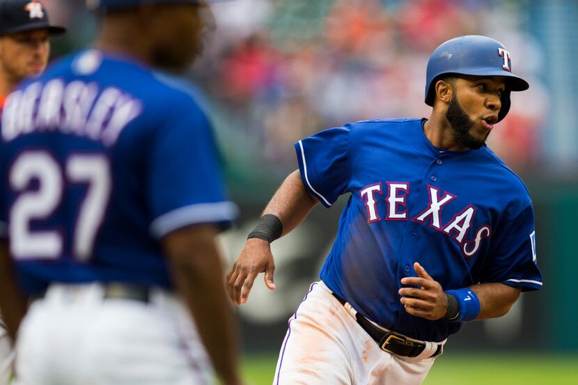 Texas Rangers shortstop Elvis Andrus (1) rounds third base after a hit by DH Adrian Beltre...