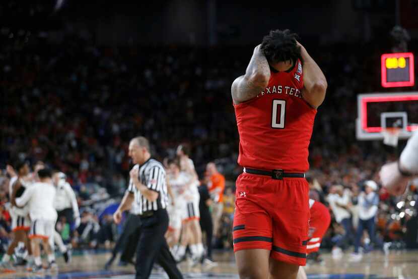 Texas Tech Red Raiders guard Kyler Edwards (0) dejected as Virginia Cavaliers celebrates a...