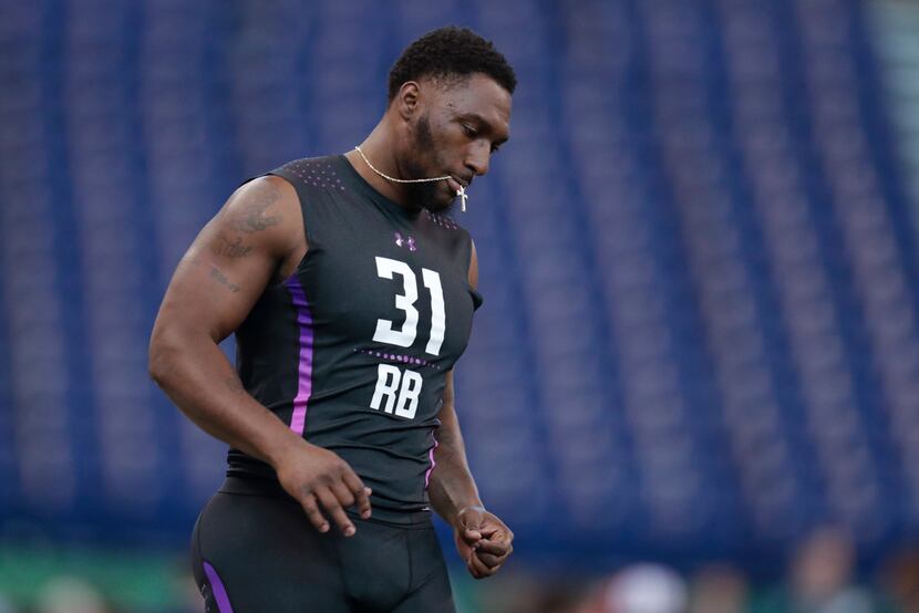 LSU running back Darrel Williams eases up after running the 40-yard dash at the NFL football...