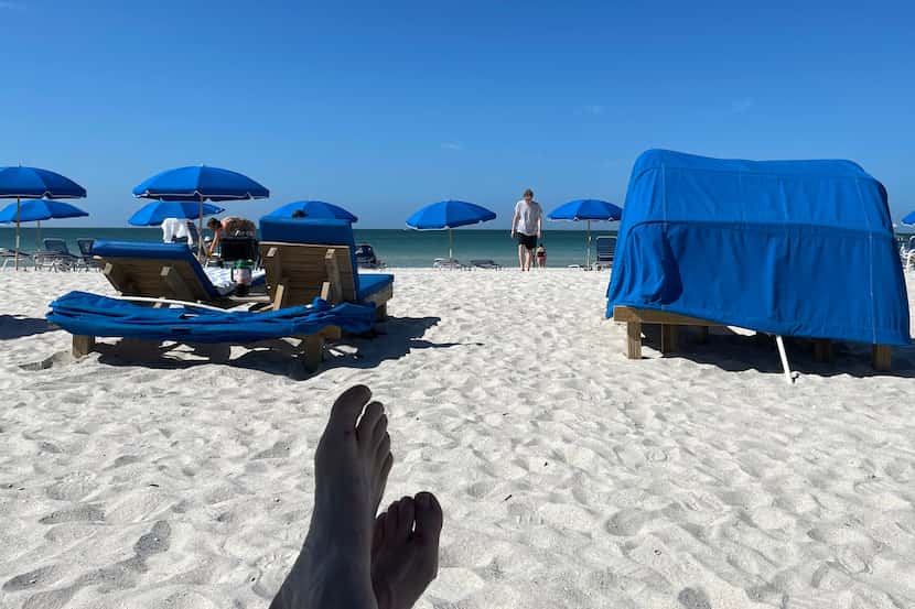 Beach umbrellas along St. Petersburg Beach. Scott Burns and a friend spent a "boots on the...