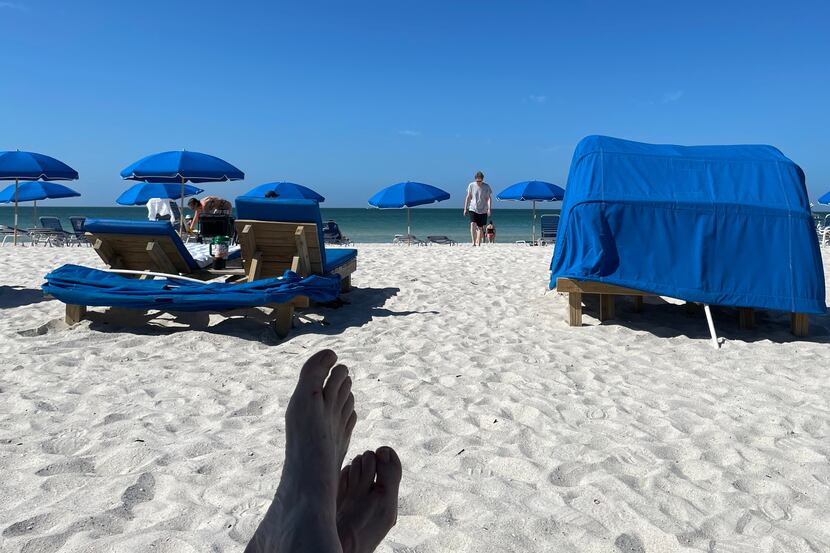 Beach umbrellas along St. Petersburg Beach. Scott Burns and a friend spent a "boots on the...