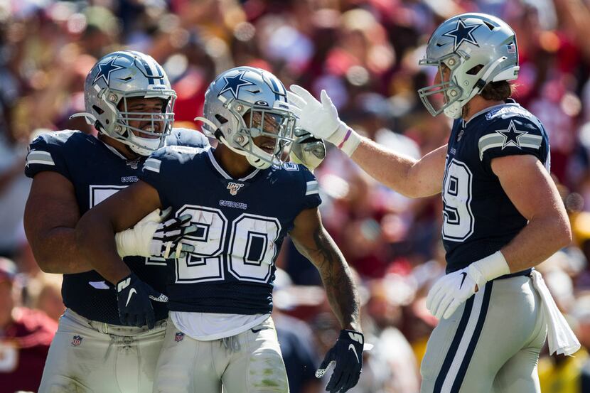 Dallas Cowboys running back Tony Pollard (20) celebrates what he thought was a touchdown...