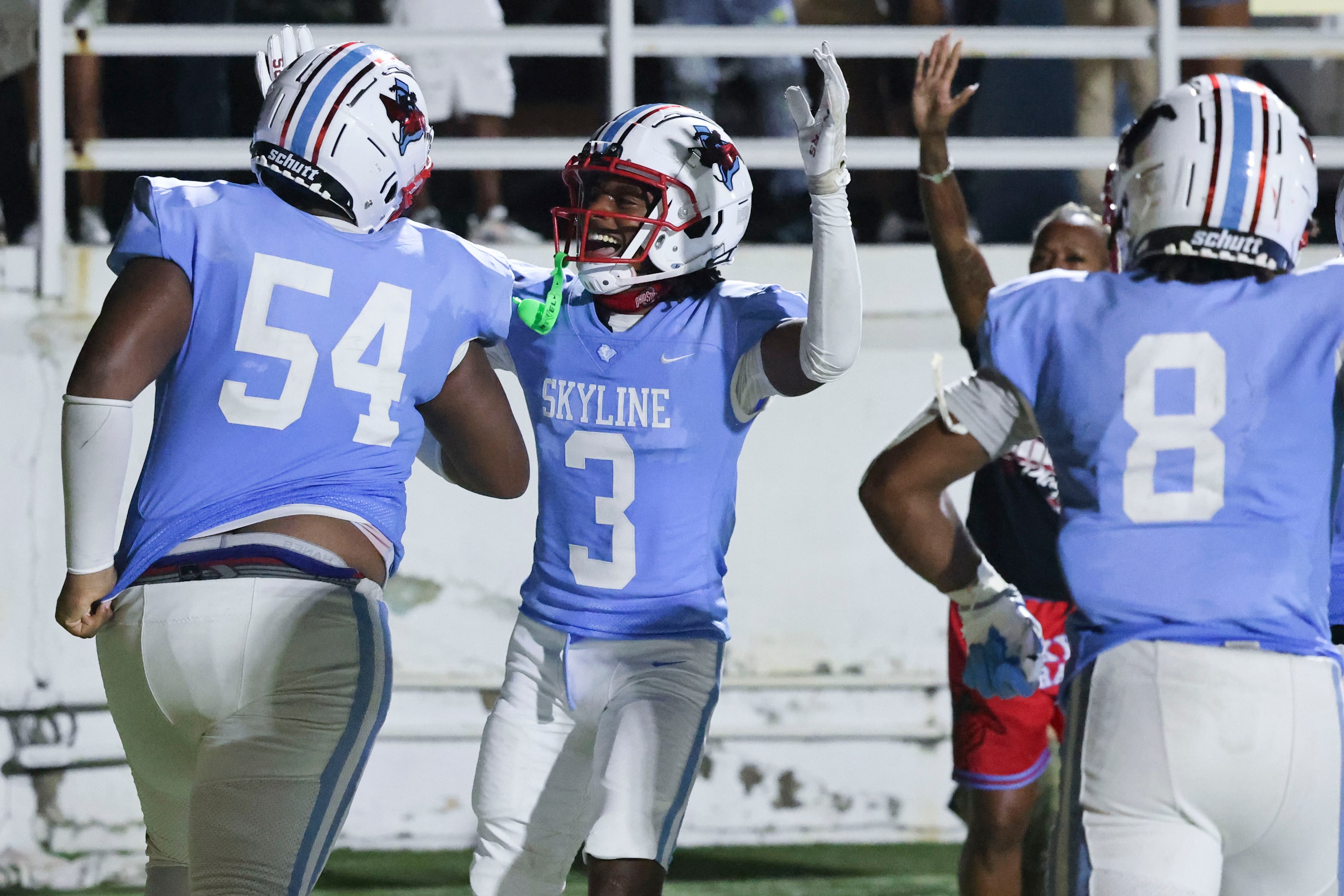 Skyline High players celebrates a two point conversion by Terrence Jones (54) during the...