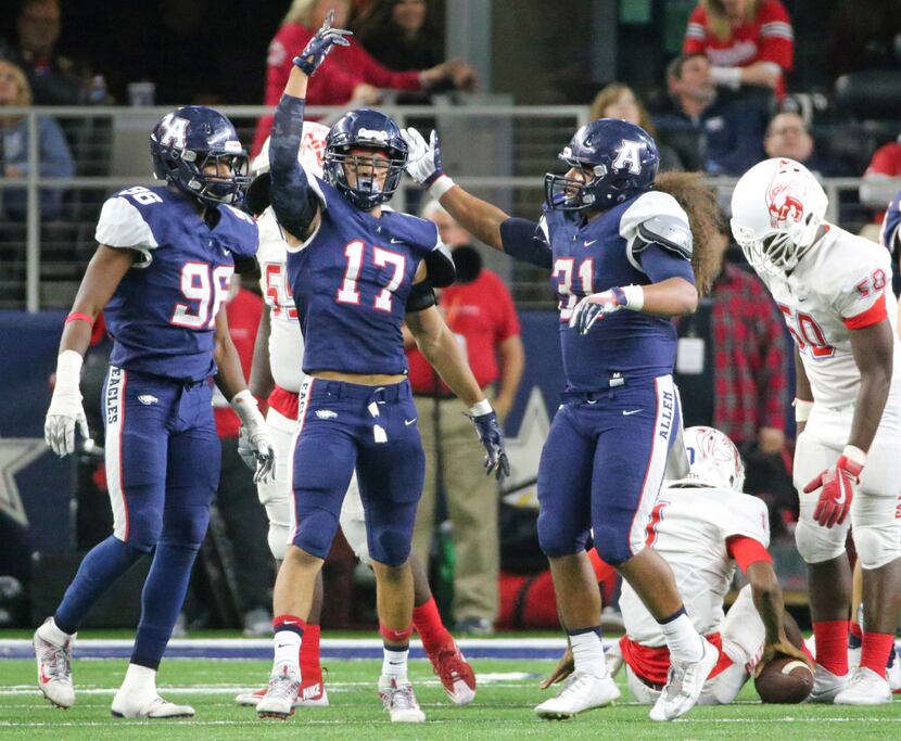 Allen defender Nigel Hines (17) celebrates a sack with teammates Cody Dillard (96) and Misi...