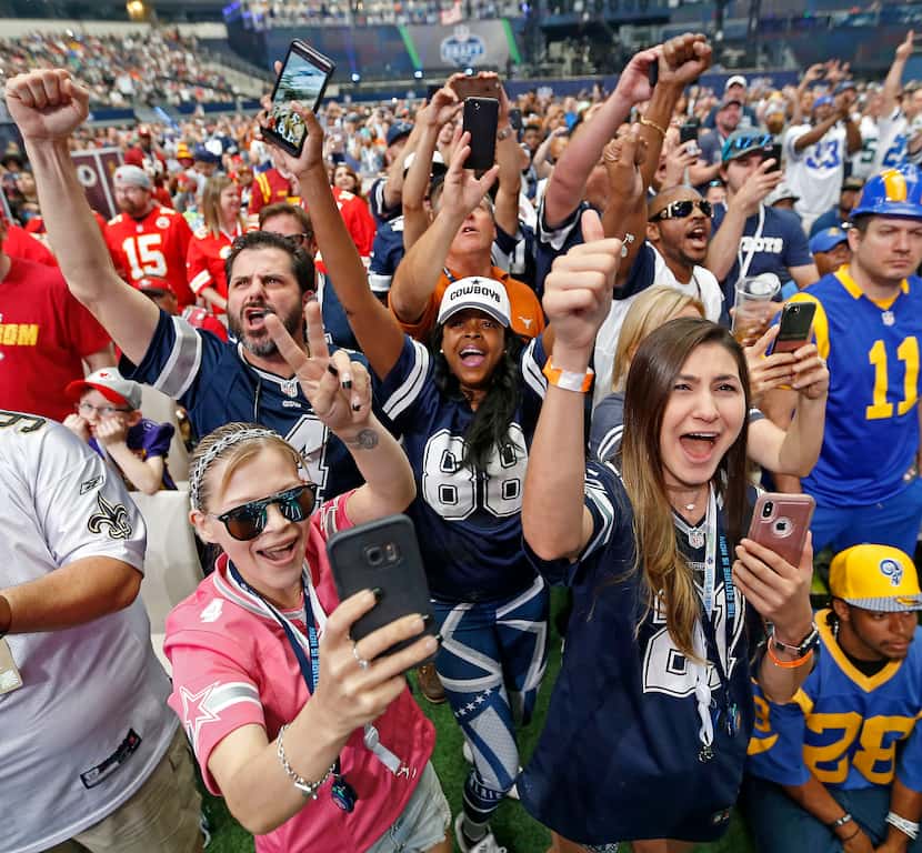 Dallas Cowboys fans including Lisa Morton, who wears a #88 jersey, cheered when the Cowboys...