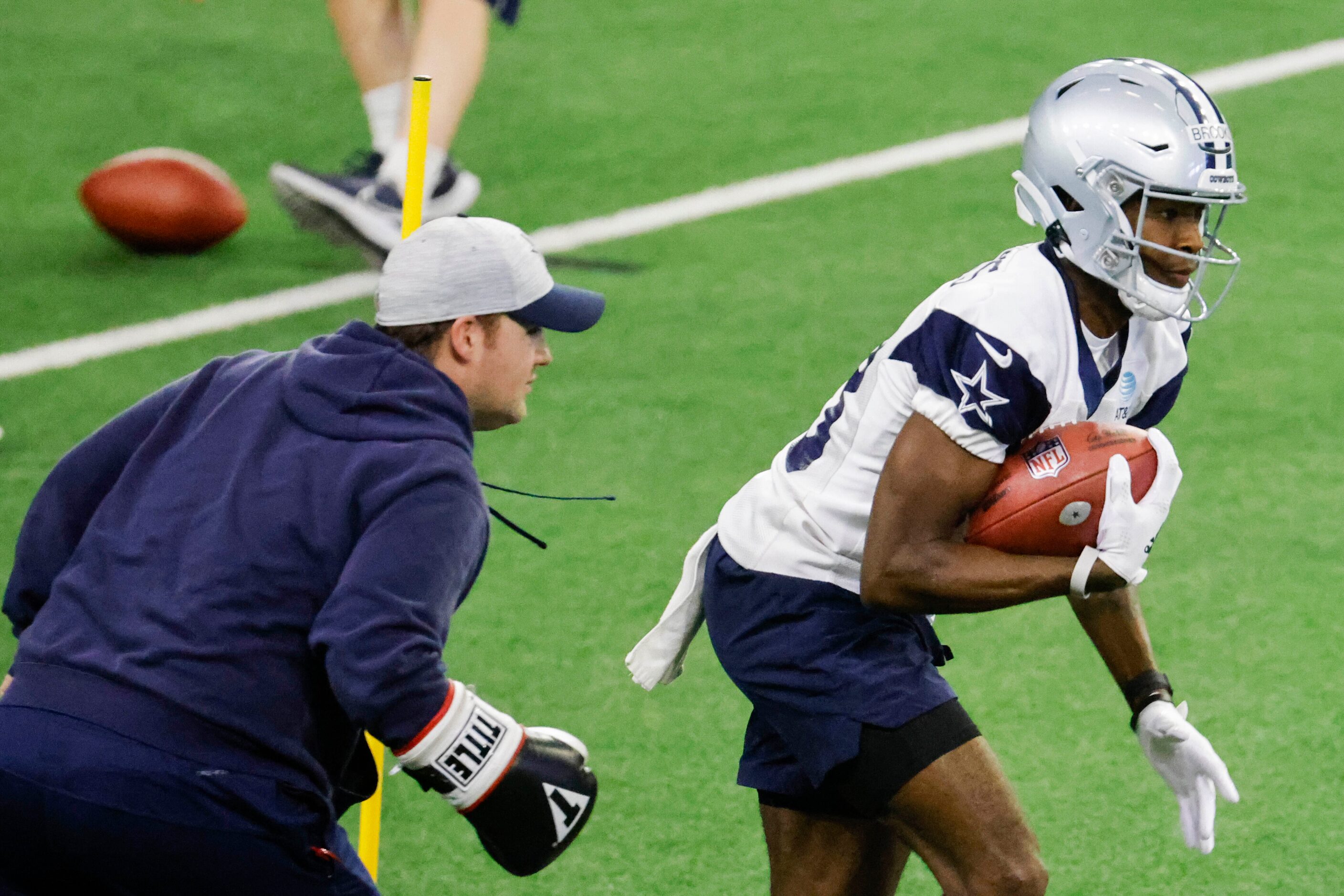 Dallas Cowboys wide receiver Jalen Brooks takes part in a drill during a mini camp session...