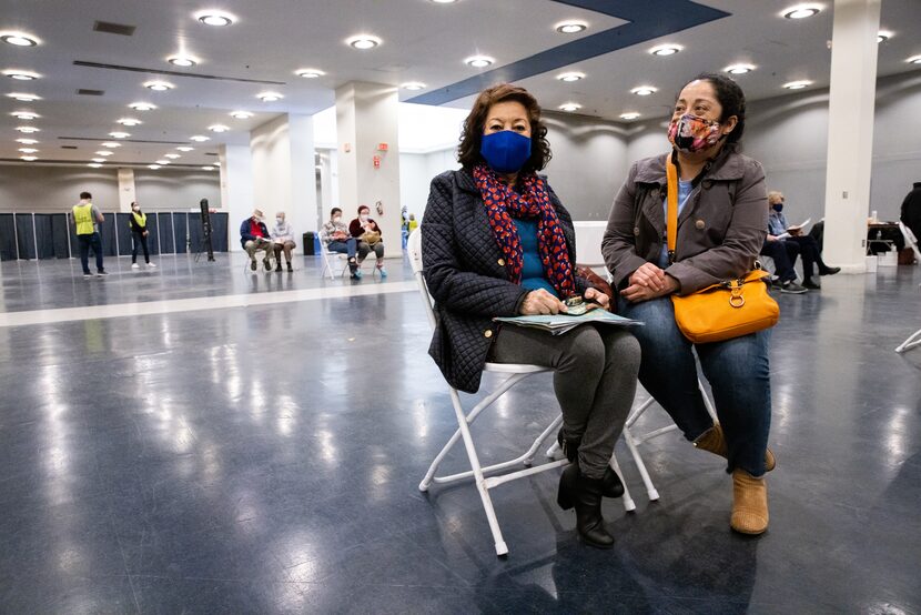 María Dolores Sanchez (left) sits with daughter Cynthia Tort-Urbina in the post-vaccination...