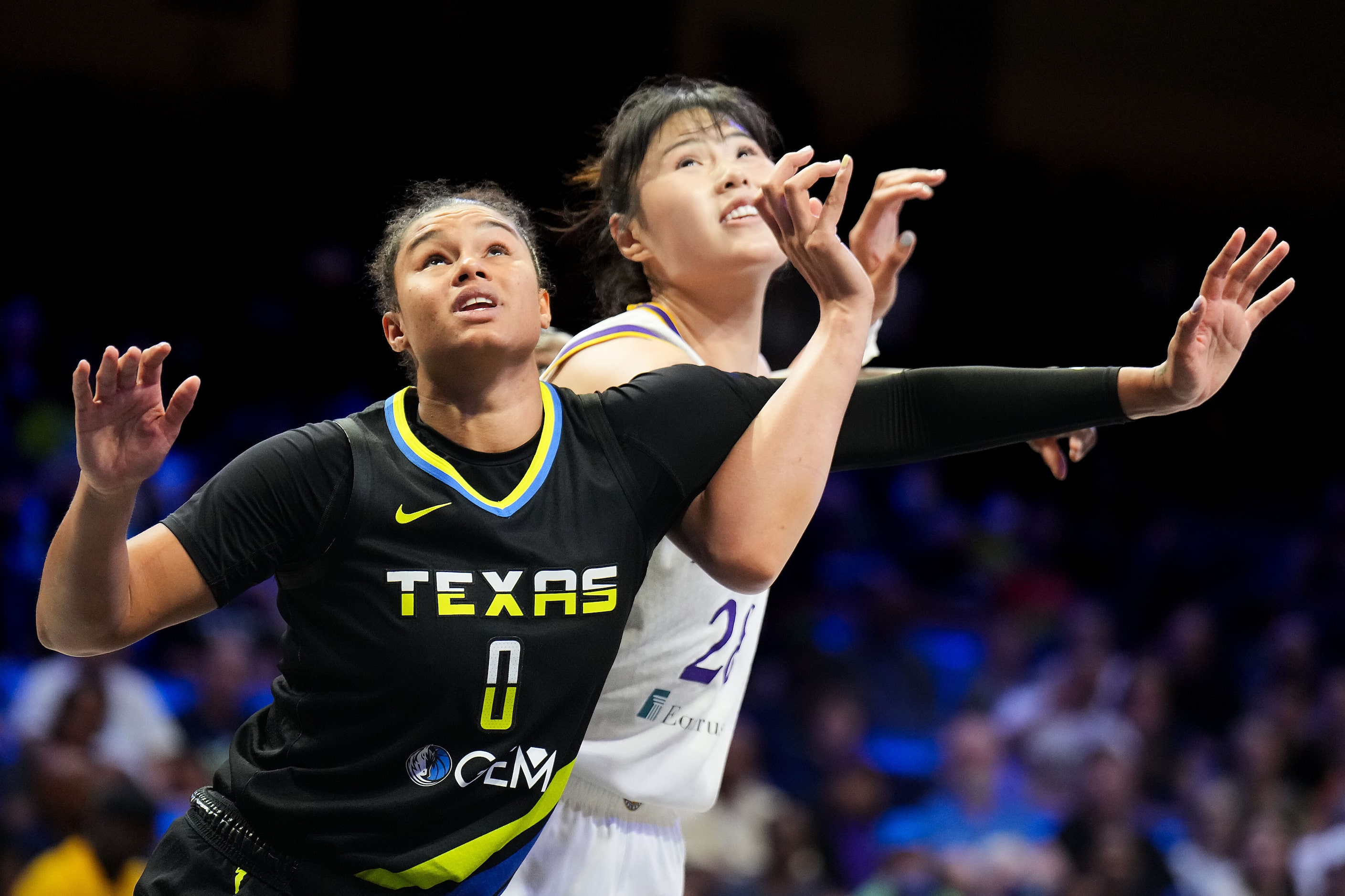 Dallas Wings forward Satou Sabally (0) fights for position against Los Angeles Sparks center...