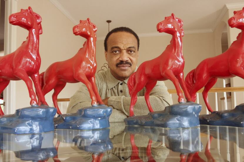 Former SMU football star Jerry Levias in his home in Houston, surrounded by Mustangs earnedÊ...