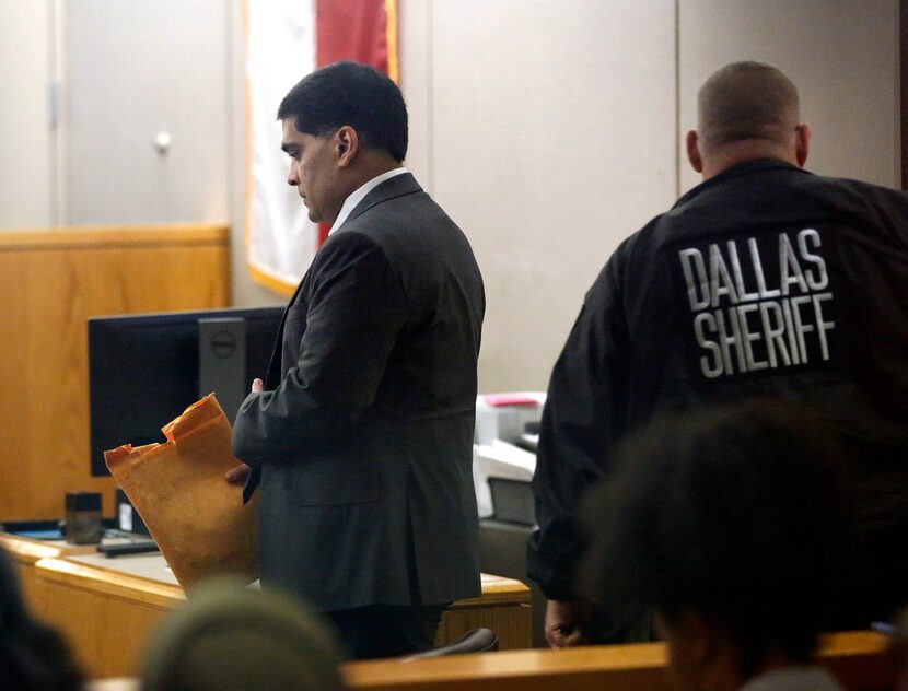 Defendant Wesley Mathews (left) enters the 282nd Judicial District Court at the Frank...