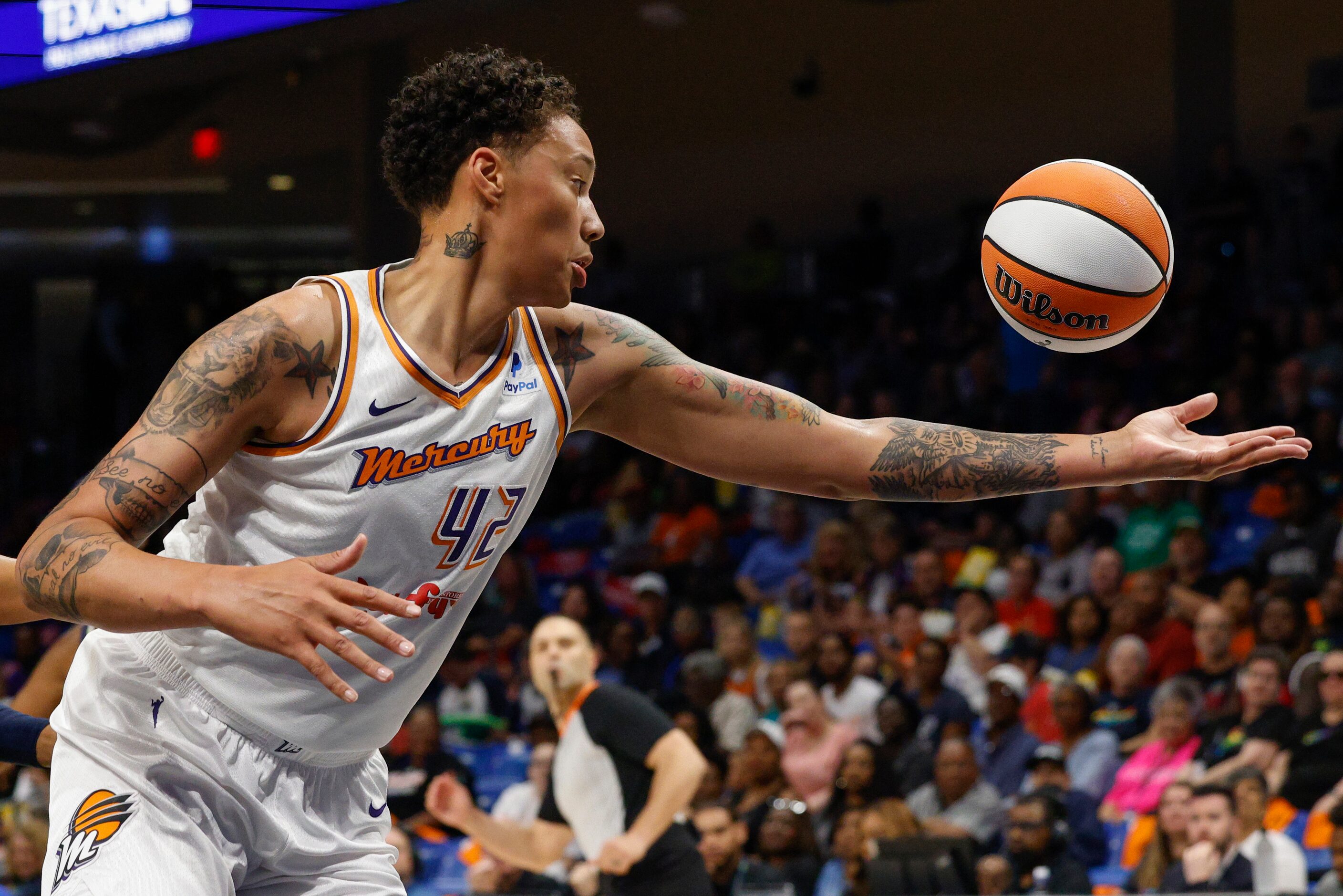 Phoenix Mercury center Brittney Griner (42) stretches to collect a rebound during the first...