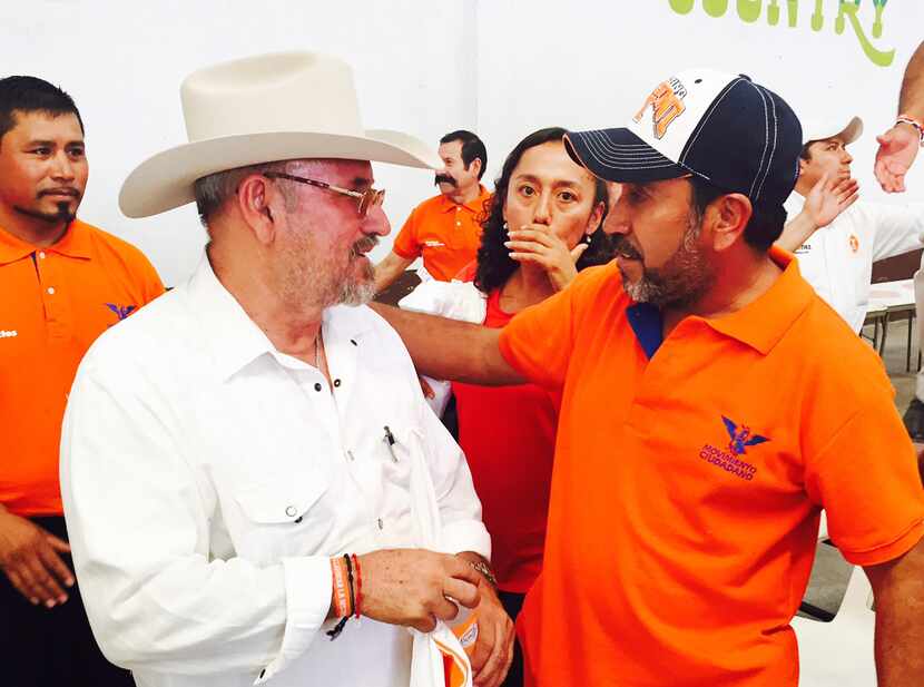 
Lime farmer and gang foe Hipolito Mora (left) is running for Mexico's Congress as an...