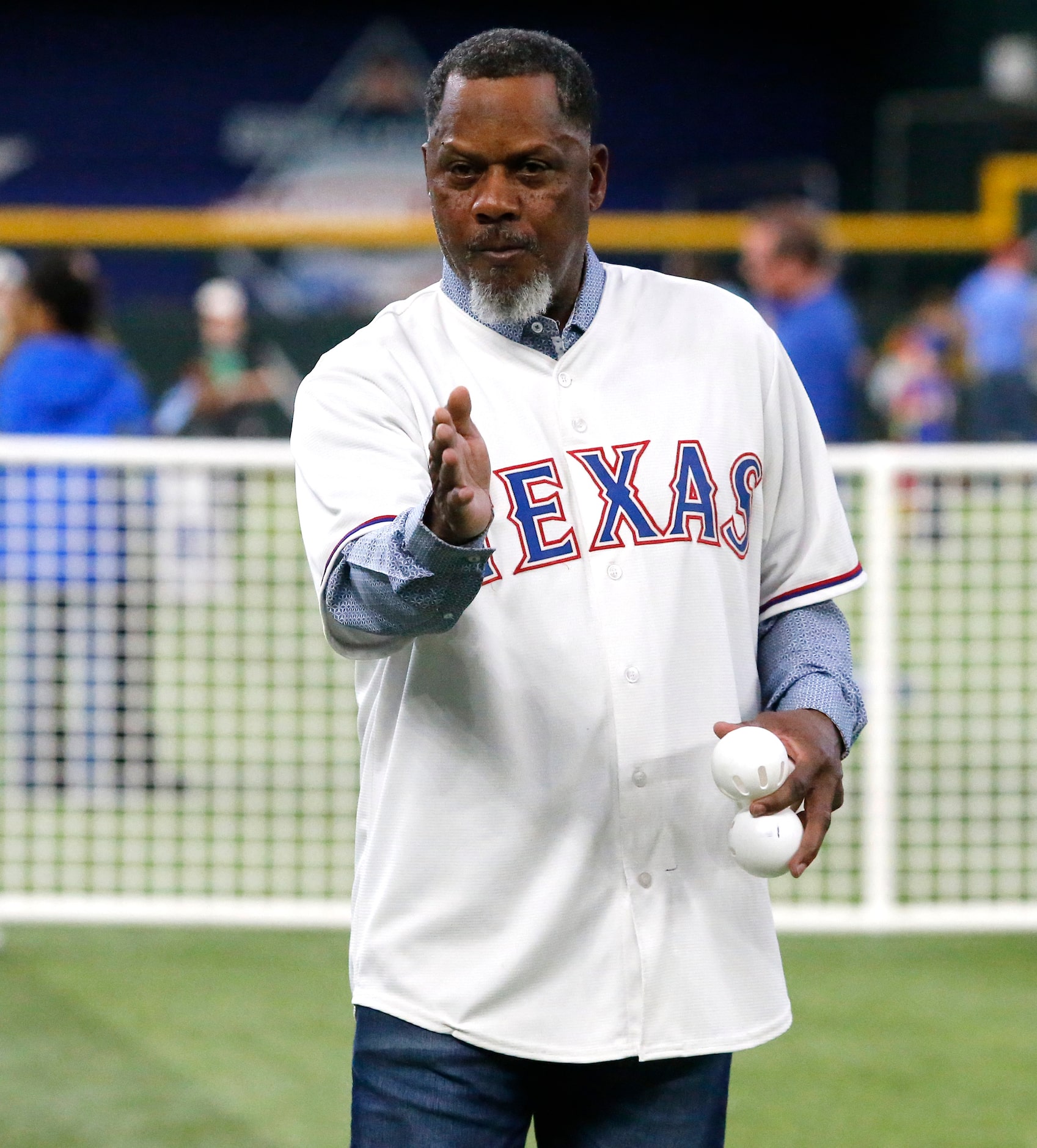 Former utility infielder for the Texas Rangers Curt Wilkerson lines up a batter before...