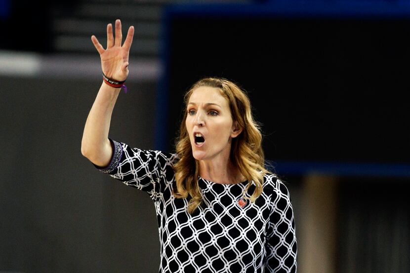 FILE - In this March 22, 2014, file photo, Fresno State head coach Raegan Pebley directs her...