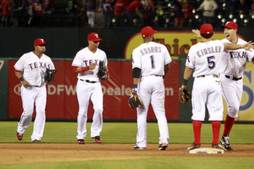Texas Rangers players celebrate after beating the Los Angeles Angels 7-3 during a MLB...