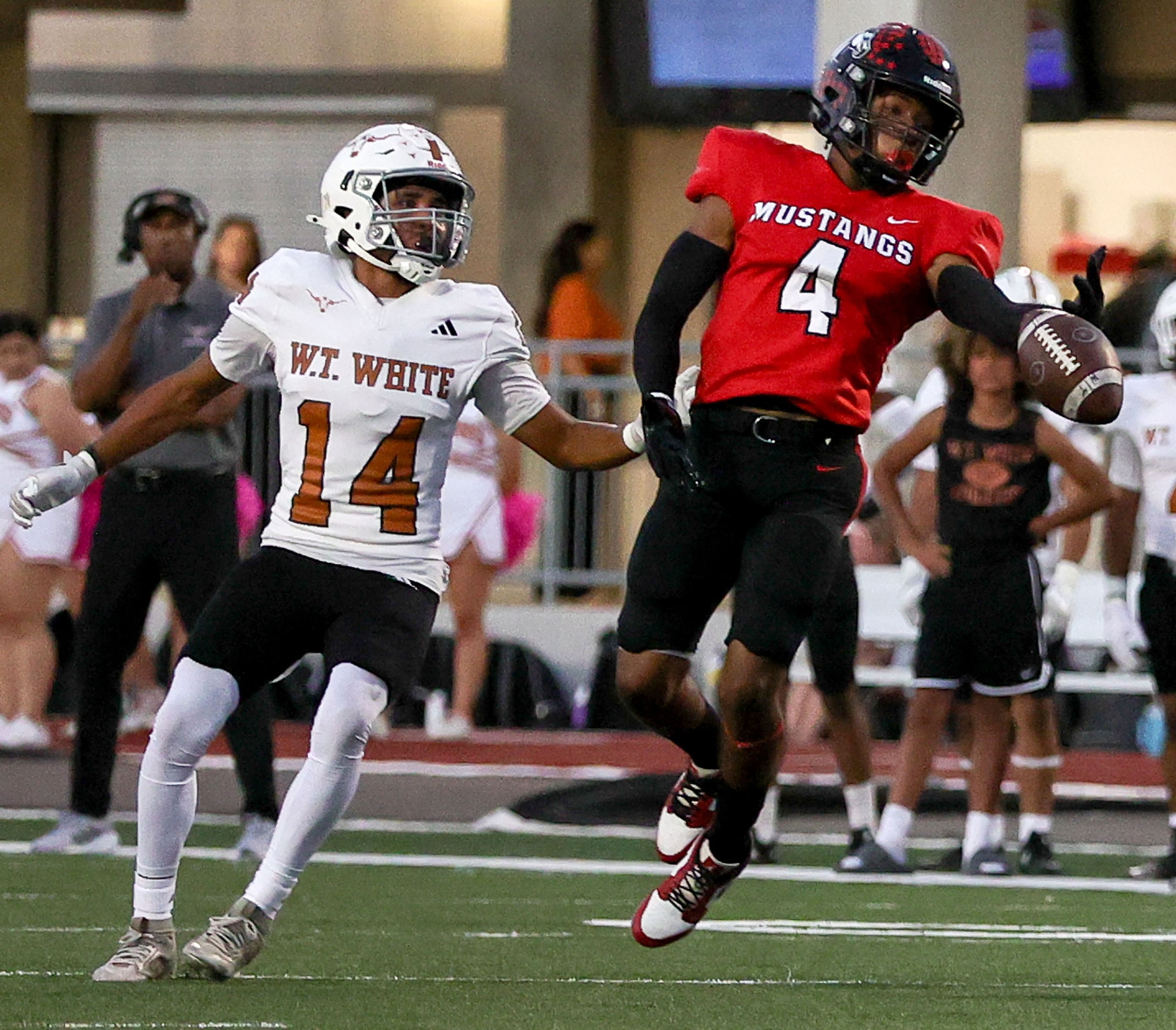 Creekview defensive back Isaiah Holliday (4) tries to come up with ball against W.T. White's...