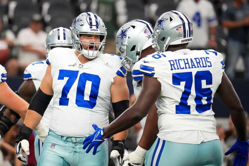 Dallas Cowboys guard Zack Martin (70) warms up before an NFL football game against the New...