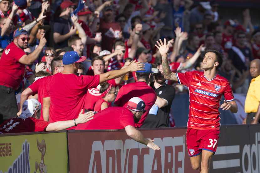 FC Dallas forward Maximiliano Urruti (37) celebrates on the sideline after scoring a goal...